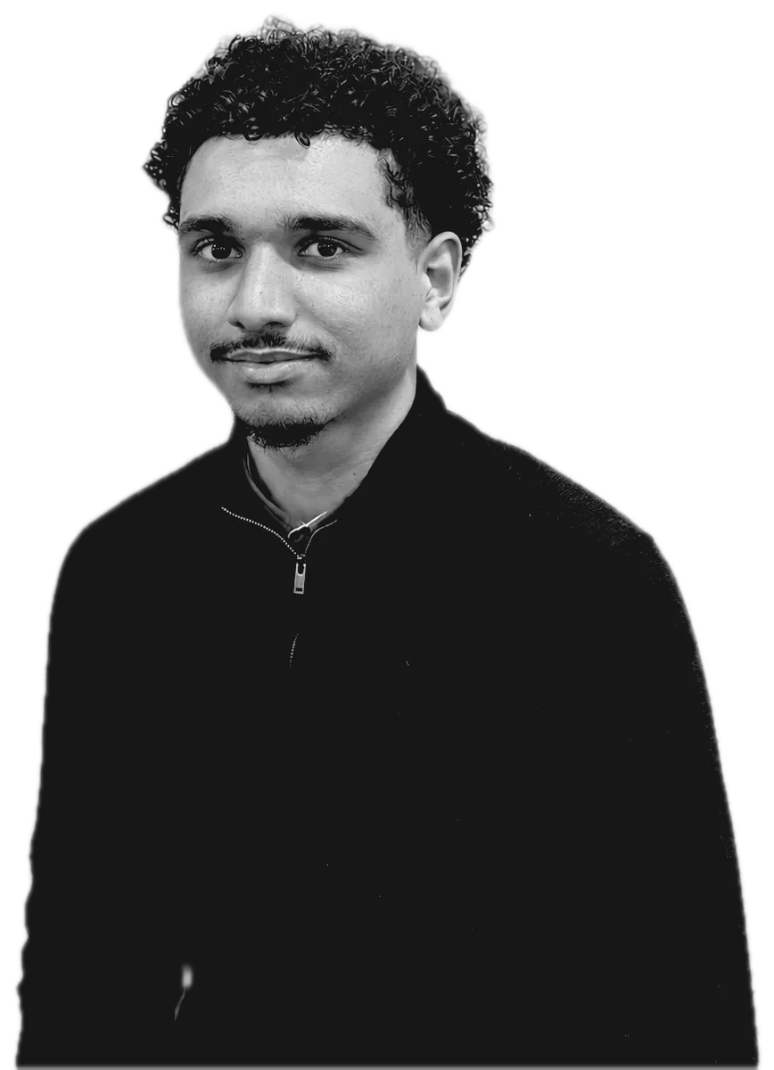 Dom Caldwell, black-and-white portrait in a quarter-zip sweater